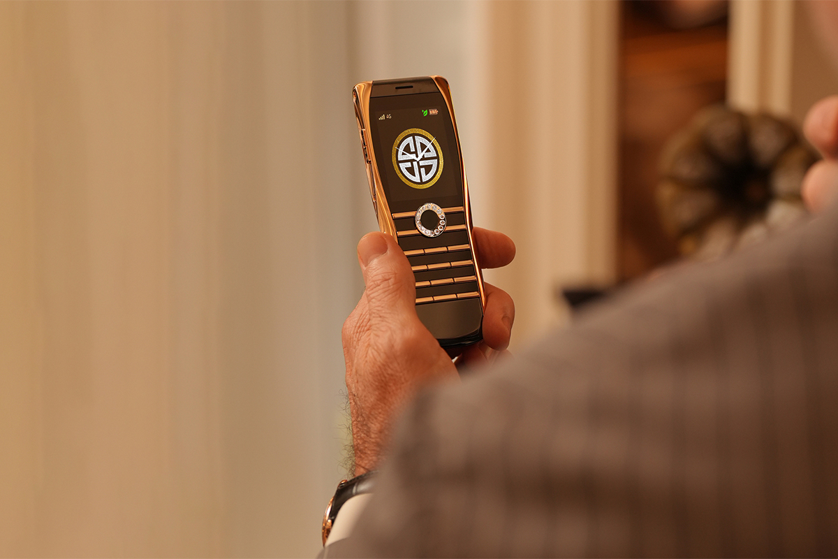 man holding XOR Elite Eternity Diamond most expensive phone in the world in luxury setting